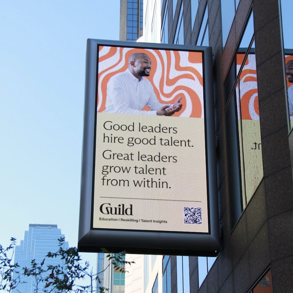 Digital street-level billboard reading Good leaders hire good talent. Great leaders grow talent from within.