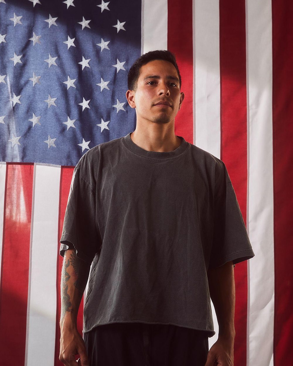 Team USA athlete photographed against an American flag for the WTH is Guild? campaign.