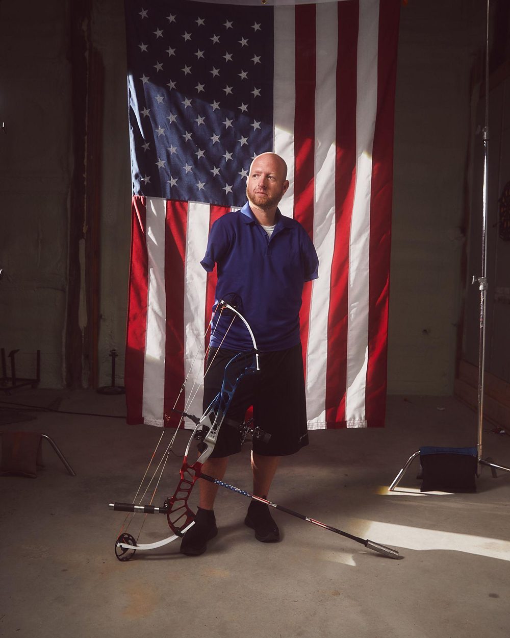 Paralympic athlete photographed against an American flag for the WTH is Guild? campaign.