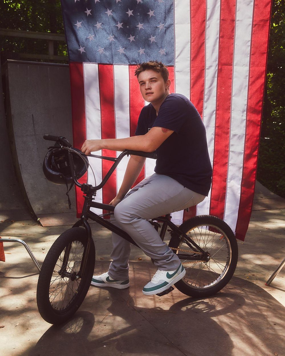 BMX athlete photographed against an American flag for the WTH is Guild? campaign.